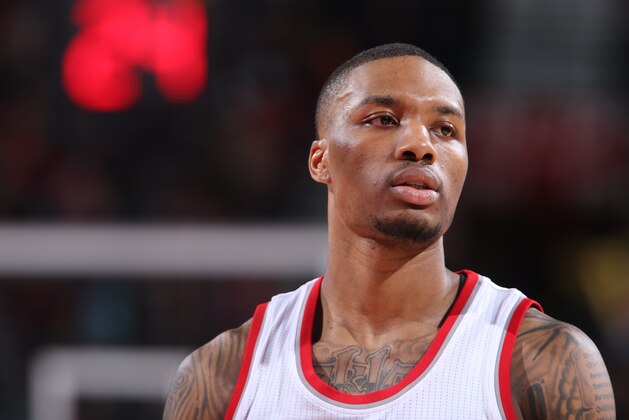 PORTLAND, OR - JANUARY 24:  Damian Lillard #0 of the Portland Trail Blazers during the game against the Washington Wizards on January 24, 2015 at the Moda Center in Portland, Oregon. NOTE TO USER: User expressly acknowledges and agrees that, by downloading and or using this Photograph, user is consenting to the terms and conditions of the Getty Images License Agreement. Mandatory Copyright Notice: Copyright 2015 NBAE (Photo by Sam Forencich/NBAE via Getty Images)