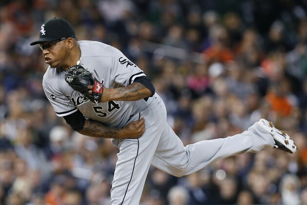 Chicago White Sox relief pitcher Ronald Belisario throws against the Detroit Tigers in the seventh inning of a baseball game in Detroit Tuesday, Sept. 23, 2014. (AP Photo/Paul Sancya)