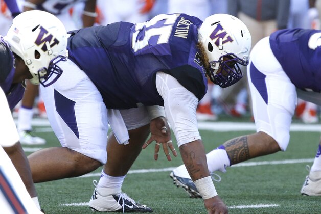 Washington defensive lineman Danny Shelton lines up on the line of scrimmage for a play against Illinois in an NCAA college football game Saturday, Sept. 13, 2014, in Seattle. (AP Photo/Ted S. Warren)