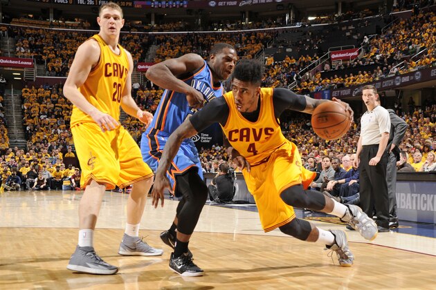CLEVELAND, OH - JANUARY 25:  Iman Shumpert #4 of the Cleveland Cavaliers handles the ball against the Oklahoma City Thunder during the game on January 25, 2015 at Quicken Loans Arena in Cleveland, Ohio. NOTE TO USER: User expressly acknowledges and agrees that, by downloading and/or using this Photograph, user is consenting to the terms and conditions of the Getty Images License Agreement. Mandatory Copyright Notice: Copyright 2015 NBAE (Photo by Bill Baptist/NBAE via Getty Images)
