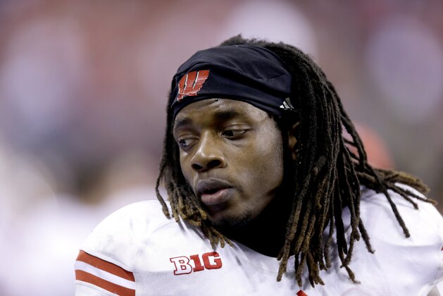 Wisconsin running back Melvin Gordon watches from the sidelines during the second half of the Big Ten Conference championship NCAA college football game against Ohio State Saturday, Dec. 6, 2014, in Indianapolis. (AP Photo/Michael Conroy)