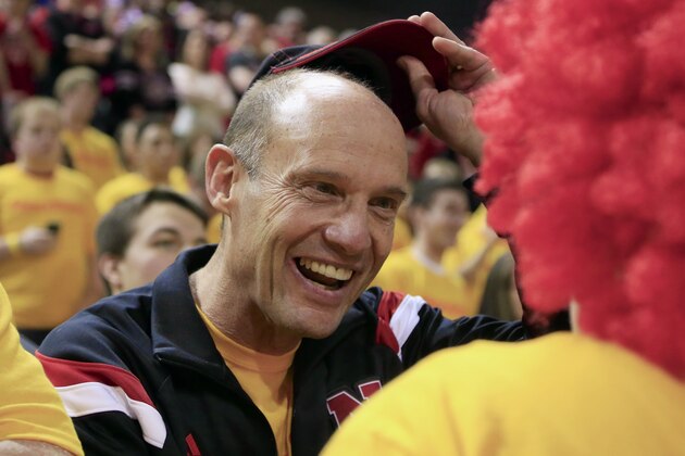 Nebraska head football coach Mike Riley greets basketball fans in the student section before an NCAA college basketball game against Michigan State in Lincoln, Neb., Saturday, Jan. 24, 2015. Nebraska won 79-77. (AP Photo/Nati Harnik)