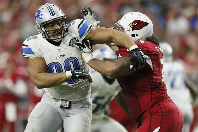 Detroit Lions defensive tackle Ndamukong Suh (90) battles Arizona Cardinals guard Paul Fanaika (74) during the first half of an NFL football game, Sunday, Nov. 16, 2014, in Glendale, Ariz. (AP Photo/Ralph Freso)