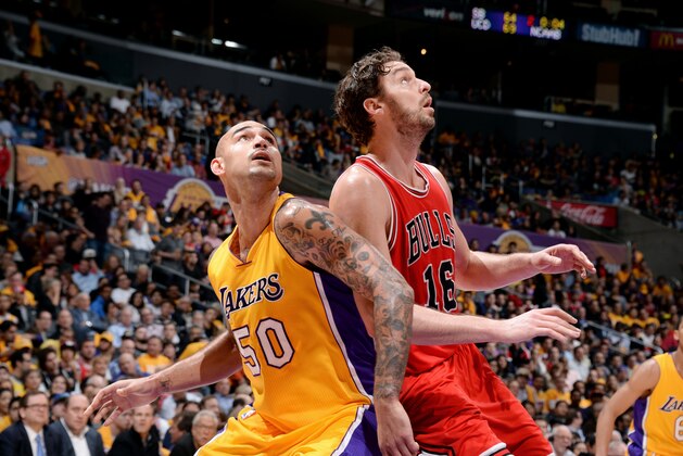 LOS ANGELES, CA - JANUARY 29: Robert Sacre #50 of the Los Angeles Lakers battles for position against Pau Gasol #16 of the Chicago Bulls at STAPLES Center on January 29, 2015 in Los Angeles, California. NOTE TO USER: User expressly acknowledges and agrees that, by downloading and/or using this Photograph, user is consenting to the terms and conditions of the Getty Images License Agreement. Mandatory Copyright Notice: Copyright 2015 NBAE (Photo by Andrew D. Bernstein/NBAE via Getty Images)