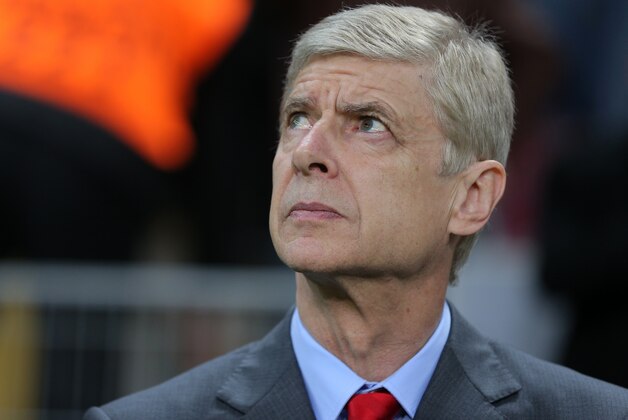 Arsenal's coach Arsene Wenger watches the game during their Champions League Group D soccer match with Galatasaray at the Turk Telekom Arena Stadium in Istanbul, Turkey, Tuesday, Dec. 9, 2014. (AP Photo)