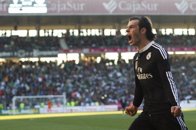 Real Madrid's Gareth Bale celebrates after scoring against Cordoba during their La Liga soccer match at the Arcangel stadium, in Cordoba, Spain on Saturday, Jan. 24, 2015. (AP Photo/Miguel Morenatti)