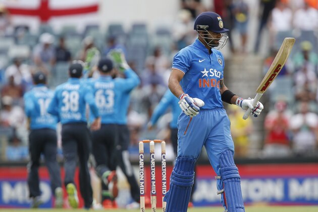 India's Virat Kohli walks back to the pavilion after losing his wicket for 8 runs during their one-day international cricket match against England in Perth, Australia, Friday, Jan. 30, 2015. (AP Photo/Theron Kirkman)
