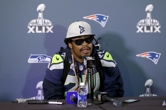 Seattle Seahawks' Marshawn Lynch answers a question during an interview for NFL Super Bowl XLIX football game, Thursday, Jan. 29, 2015, in Phoenix. The Seahawks play the New England Patriots in Super Bowl XLIX on Sunday, Feb. 1, 2015. (AP Photo/Matt York)