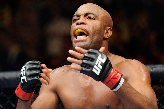 Anderson Silva taunts Chris Weidman between rounds during their UFC 162 mixed martial arts middleweight championship bout at the MGM Grand Garden Arena on Saturday, July 6, 2013, in Las Vegas. Weidman won the fight with a second round TKO. (AP Photo/David Becker)