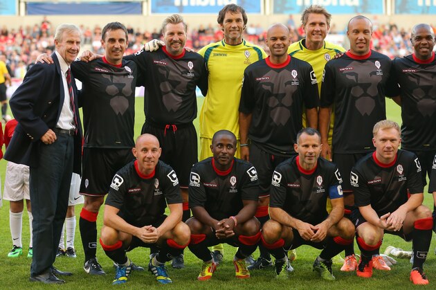 SALFORD, ENGLAND - AUGUST 07: Former Manchester United youth coach Eric Harrison, left, lines up with Gary Neville, second left, and other members of the Class of 92 squad during the match between Salford City and the Class of '92 XI at AJ Bell Stadium on August 7, 2014 in Salford, England.  (Photo by Dave Thompson/Getty Images)