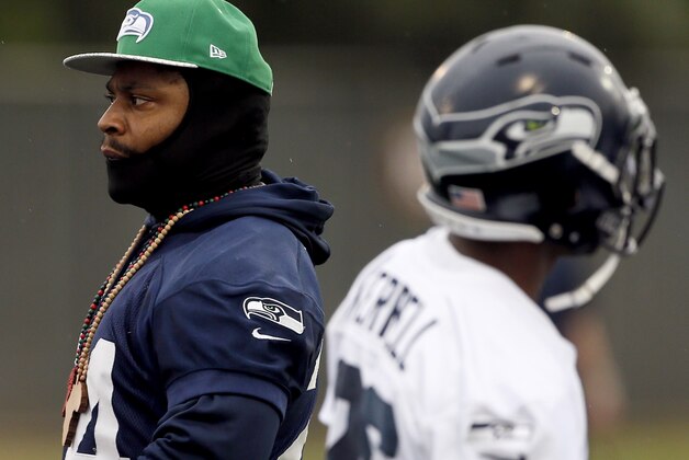 Seattle Seahawks' Marshawn Lynch watches his teammates during a team practice for NFL Super Bowl XLIX football game, Thursday, Jan. 29, 2015, in Tempe, Ariz. The Seahawks play the New England Patriots in Super Bowl XLIX on Sunday, Feb. 1, 2015. (AP Photo/Matt York)