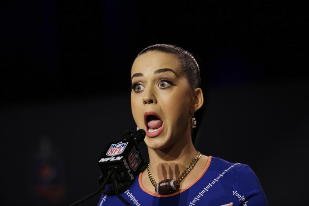 Katy Perry answers questions at a halftime news conference for NFL Super Bowl XLIX football game Thursday, Jan. 29, 2015, in Phoenix. (AP Photo/David J. Phillip)