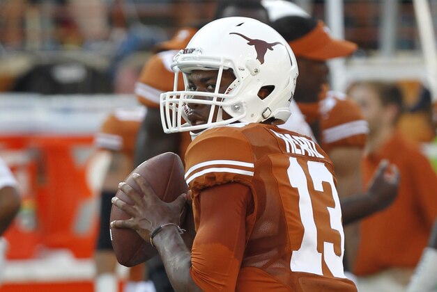 AUSTIN, TX - SEPTEMBER 6: Jerrod Heard #13 of the Texas Longhorns passes during pre game warmups before playing the BYU Cougars on September 6, 2014 at Darrell K Royal-Texas Memorial Stadium in Austin, Texas. (Photo by Chris Covatta/Getty Images)