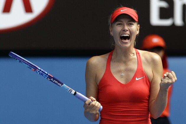 Maria Sharapova of Russia celebrates after defeating her compatriot Ekaterina Makarova in their semifinal match at the Australian Open tennis championship in Melbourne, Australia, Thursday, Jan. 29, 2015. (AP Photo/Lee Jin-man)