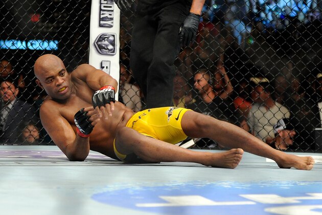 Anderson Silva gets from the canvas after Chris Weidman won their UFC 162 mixed martial arts middleweight championship bout by a TKO at the MGM Grand Garden Arena on Saturday, July 6, 2013, in Las Vegas. (AP Photo/David Becker)