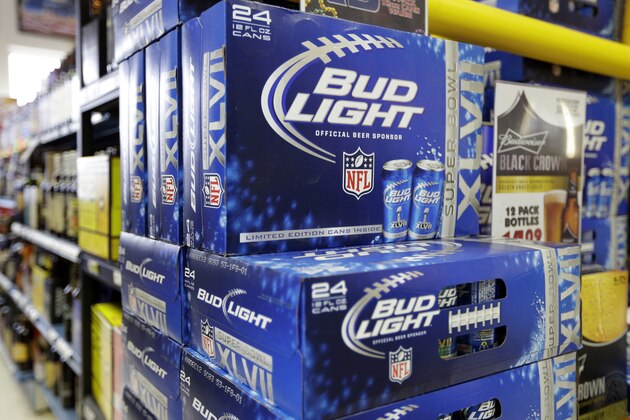 Bud Light beer is shown in the aisles of Elite Beverages in Indianapolis, Monday, Jan. 28, 2013.  (AP Photo/Michael Conroy)
