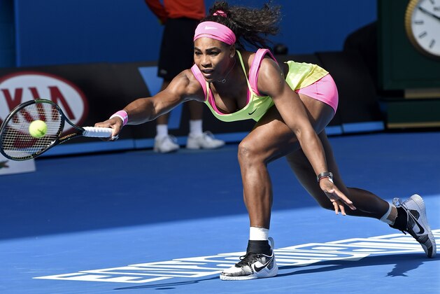 Serena Williams of the U.S. reaches for a shot to her compatriot Madison Keys during their semifinal match at the Australian Open tennis championship in Melbourne, Australia, Thursday, Jan. 29, 2015. (AP Photo/Andy Brownbill)