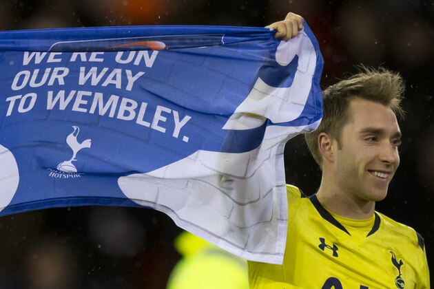 Tottenham's Christian Eriksen celebrates with teammates after his team's English League Cup Semi-Final victory over Sheffield United at Bramall Lane Stadium, Sheffield, England, Wednesday, Jan. 28, 2015. (AP Photo/Jon Super)
