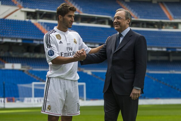 Brazil international soccer player Lucas Silva, left, and Real Madrid President Florentino Perez pose during his official presentation at the Santiago Bernabeu stadium in Madrid, Spain, Monday, Jan. 26, 2015, after signing for Real Madrid. (AP Photo/Andres Kudacki)