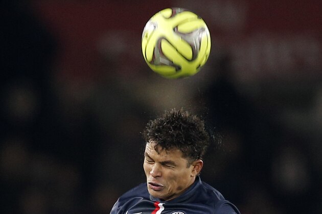 Paris St Germain's Thiago Silva, top, and  Rennes' Ola Toivonen jump for the ball during the French league one soccer match between Paris Saint Germain and Rennes, in Paris, France, Friday, Jan. 30, 2015. (AP Photo/Christophe Ena)