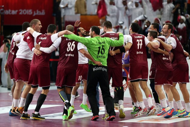 Players from Qatar celebrate their win following the 24th Men's Handball World Championships semifinals match between Poland and Qatar at the Lusail Multipurpose Hall, in Doha, Qatar, Friday, Jan. 30, 2015. (AP Photo/Osama Faisal