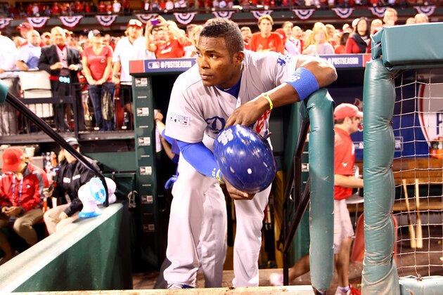 ST LOUIS, MO - OCTOBER 07:  Yasiel Puig #66 of the Los Angeles Dodgers looks on from the dugout steps after being defeated by the St. Louis Cardinals in Game Four of the National League Divison Series at Busch Stadium on October 7, 2014 in St Louis, Missouri.  (Photo by Jamie Squire/Getty Images)