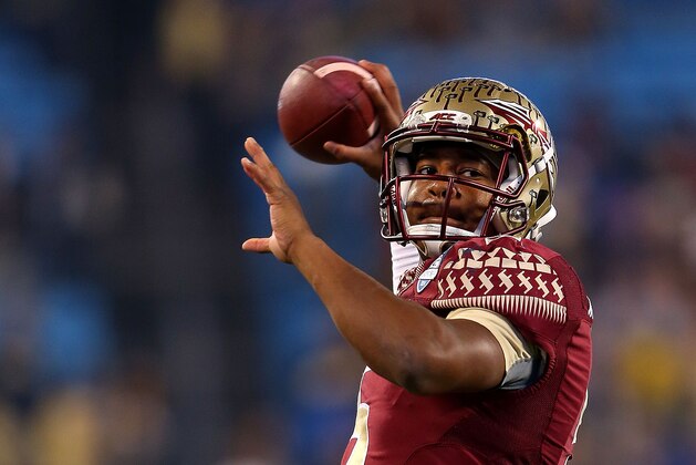 CHARLOTTE, NC - DECEMBER 06: Jameis Winston #5 of the Florida State Seminoles throws a warm pass before the game against the Georgia Tech Yellow Jackets at the ACC Championship game on December 6, 2014 in Charlotte, North Carolina. (Photo by Mike Ehrmann/Getty Images)