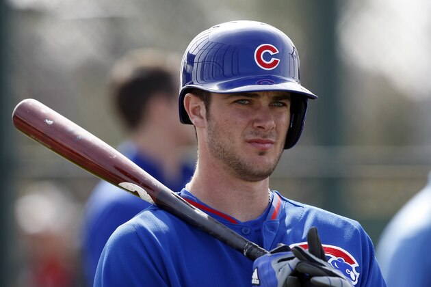 FILE - In this Feb. 21, 2014, file photo, Chicago Cubs third baseman Kris Bryant (77) takes batting practice during spring training baseball practice in Mesa, Ariz. Every time top Cubs prospect Kris Bryant hits a home run, proud papa Mike Bryant beams back home in Las Vegas.   (AP Photo/Rick Scuteri, File)