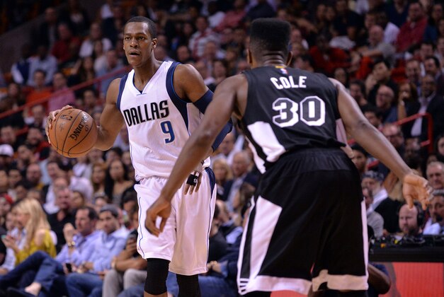 Jan 30, 2015; Miami, FL, USA; Dallas Mavericks guard Rajon Rondo (9) dribbles against Miami Heat guard Norris Cole (30) during the first half at American Airlines Arena. Mandatory Credit: Steve Mitchell-USA TODAY Sports