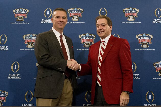 Ohio State coach Urban Meyer, left, and Alabama head coach Nick Saban shake hands during a press conference at the Marriott downtown convention center in New Orleans, Wednesday, Dec. 31, 2014. Ohio State is slated to square off against Alabama in the Sugar Bowl on New Year's Day. (AP Photo/Brynn Anderson)