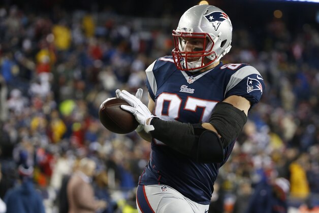 New England Patriots tight end Rob Gronkowski (87) makes a catch before the NFL football AFC Championship game between the New England Patriots and Indianapolis Colts Sunday, Jan. 18, 2015, in Foxborough, Mass. (AP Photo/Elise Amendola)