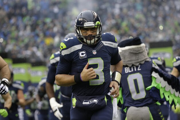 Seattle Seahawks quarterback Russell Wilson (3) takes the field prior to the NFL football NFC Championship game against the Green Bay Packers Sunday, Jan. 18, 2015, in Seattle. (AP Photo/David J. Phillip)