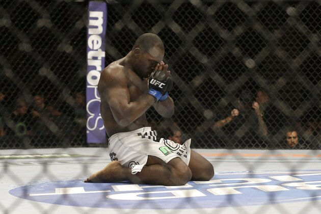 Derek Brunson kneels in the center of the cage after a middleweight mixed martial arts bout against Lorenz Larkin at UFC 177 in Sacramento, Calif., Saturday, Aug. 30, 2014. Brunson won by unanimous decision. (AP Photo/Jeff Chiu)