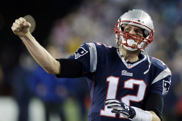 New England Patriots quarterback Tom Brady cheers as he comes on the field for warm up's before the NFL football AFC Championship game between the Patriots and Indianapolis Colts Sunday, Jan. 18, 2015, in Foxborough, Mass. (AP Photo/Charles Krupa)