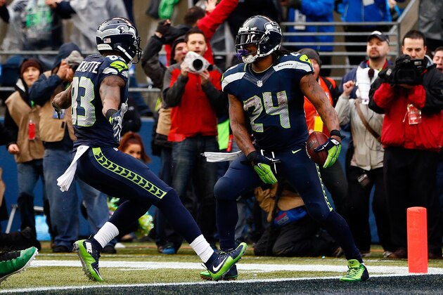 SEATTLE, WA - JANUARY 18:  Marshawn Lynch #24 of the Seattle Seahawks gestures after scoring a touchdown against the Green Bay Packers during the 2015 NFC Championship game at CenturyLink Field on January 18, 2015 in Seattle, Washington.  (Photo by Kevin C. Cox/Getty Images)