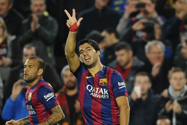 FC Barcelona's Luis Suarez, from Uruguay, reacts after scoring during a Spanish La Liga soccer match against Atletico Madrid , at the Camp Nou stadium in Barcelona, Spain, Sunday, Jan. 11, 2015. (AP Photo/Manu Fernandez)