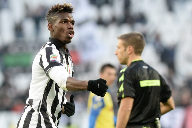 Juventus' Paul Pogba celebrates after scoring during a Serie A soccer match between Juventus and Chievo Verona at the Juventus stadium, in Turin, Italy, Sunday, Jan. 25, 2015. (AP Photo/Massimo Pinca)