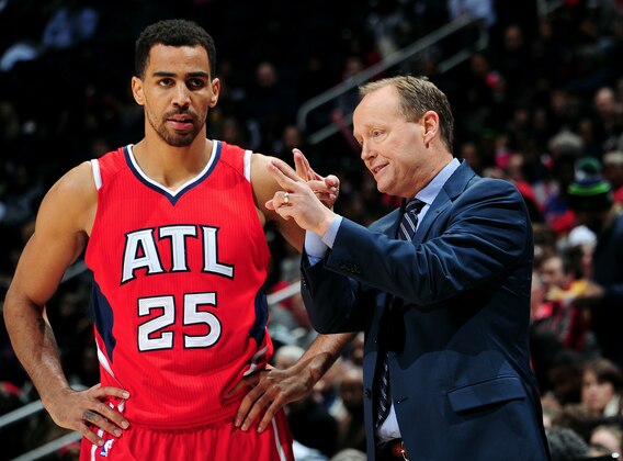 ATLANTA, GA - JANUARY 19: Head Coach Mike Budenholzer of the Atlanta Hawks duscusses a play with Thabo Sefolosha #25 during the game against the Detroit Pistons on January 19, 2015 at Philips Arena in Atlanta, Georgia.  NOTE TO USER: User expressly acknowledges and agrees that, by downloading and/or using this Photograph, user is consenting to the terms and conditions of the Getty Images License Agreement. Mandatory Copyright Notice: Copyright 2014 NBAE (Photo by Scott Cunningham/NBAE via Getty Images)