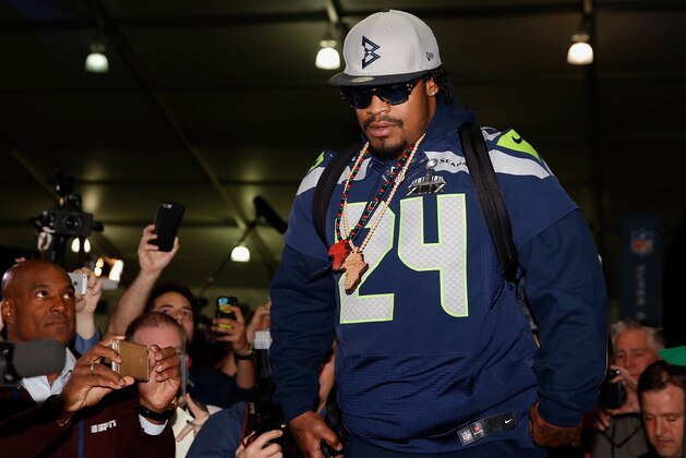 CHANDLER, AZ - JANUARY 29:  Running back Marshawn Lynch #24 of the Seattle Seahawks arrives to a Super Bowl XLIX media availability at the Arizona Grand Hotel on January 29, 2015 in Chandler, Arizona.  (Photo by Christian Petersen/Getty Images)