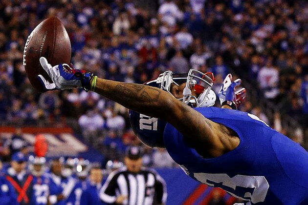 EAST RUTHERFORD, NJ - NOVEMBER 23:  Odell Beckham #13 of the New York Giants scores a touchdown in the second quarter against the Dallas Cowboys at MetLife Stadium on November 23, 2014 in East Rutherford, New Jersey.  (Photo by Al Bello/Getty Images)