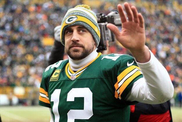Jan 11, 2015; Green Bay, WI, USA; Green Bay Packers quarterback Aaron Rodgers (12) waves to the crowd after the 2014 NFC Divisional playoff football game against the Dallas Cowboys at Lambeau Field. Mandatory Credit: Andrew Weber-USA TODAY Sports