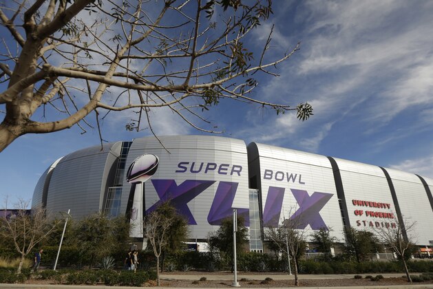 The Super Bowl XLIX logo is displayed on the University of Phoenix Stadium before the Pro Bowl Sunday, Jan. 25, 2015, in Glendale, Ariz. The venue will also host Super Bowl XLIX between the New England Patriots and the Seattle Seahawks on Sunday, Feb. 1, 2015. (AP Photo/Charlie Riedel)