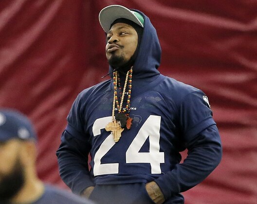 Seattle Seahawks' Marshawn Lynch stretches during a team practice for NFL Super Bowl XLIX football game, Friday, Jan. 30, 2015, in Tempe, Ariz. The Seahawks play the New England Patriots in Super Bowl XLIX on Sunday, Feb. 1, 2015. (AP Photo/Matt York)