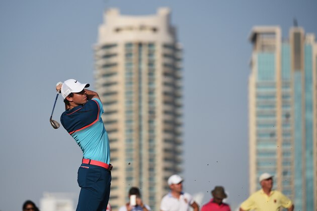 DUBAI, UNITED ARAB EMIRATES - FEBRUARY 01: Rory McIlroy of Northern Ireland plays his second shot on the 17th hole during the final round of the Omega Dubai Desert Classic at the Emirates Golf Club on February 1, 2015 in Dubai, United Arab Emirates.  (Photo by Ross Kinnaird/Getty Images)