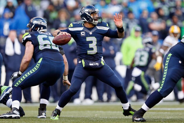 SEATTLE, WA - JANUARY 18:  Quarterback Russell Wilson #3 of the Seattle Seahawks throws a pass during the 2015 NFC Championship game against the Green Bay Packers at CenturyLink Field on January 18, 2015 in Seattle, Washington. The Seahawks defeated the Packers 28-22 in overtime.  (Photo by Christian Petersen/Getty Images)