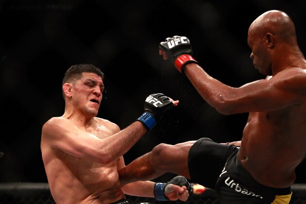LAS VEGAS, NV - JANUARY 31:  Nick Diaz (L) takes a kick from Anderson Silva in a middleweight bout during UFC 183 at the MGM Grand Garden Arena on January 31, 2015 in Las Vegas, Nevada. Silva won by unanimous decision.  (Photo by Steve Marcus/Getty Images)