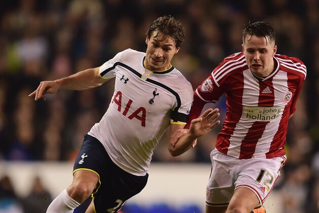 LONDON, ENGLAND - JANUARY 21:  Benjamin Stambouli of Spurs and Marc McNulty of Sheffield United battle for the ball during the Capital One Cup Semi-Final first leg match between Tottenham Hotspur and Sheffield United at White Hart Lane on January 21, 2015 in London, England.  (Photo by Jamie McDonald/Getty Images)