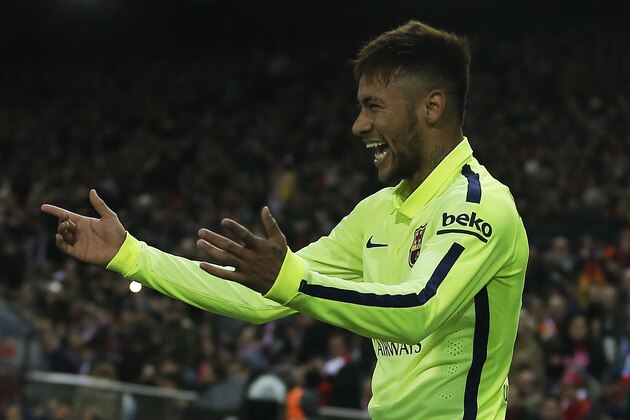 Barcelona's Neymar celebrates his second goal during a second leg quarterfinal Copa del Rey soccer match between Atletico de Madrid and FC Barcelona at the Vicente Calderon stadium in Madrid, Spain, Wednesday, Jan. 28, 2015. (AP Photo/Andres Kudacki)