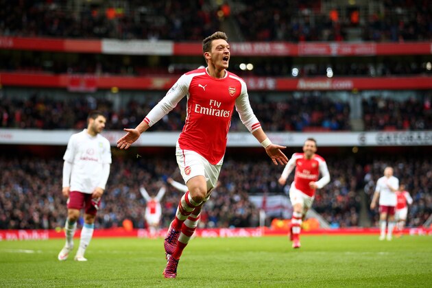 LONDON, ENGLAND - FEBRUARY 01:  Mesut Oezil of Arsenal celebrates after scoring his team's second goal during the Barclays Premier League match between Arsenal and Aston Villa at the Emirates Stadium on February 1, 2015 in London, England.  (Photo by Paul Gilham/Getty Images)