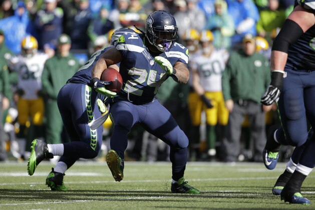 Seattle Seahawks running back Marshawn Lynch (24) runs against the Green Bay Packers during the first half of the NFL football NFC Championship game Sunday, Jan. 18, 2015, in Seattle. (AP Photo/Ted S. Warren)